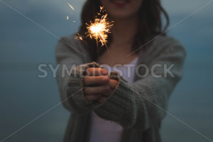 Girl Holding a Sparkler Firework - Symbiostock Express Demo